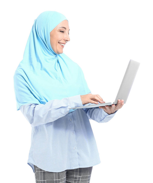 Muslim secretary with laptop on white background - 写真・画像