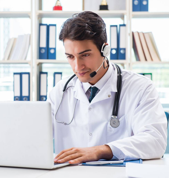 Young male doctor in telehealth concept - Photo, Image