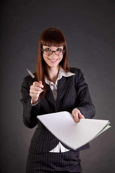 Cheerful businesswoman with documents and pen - Zdjęcie, obraz