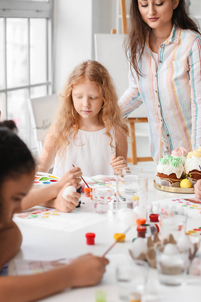 Cute children painting during master-class in art on Easter eve - Photo, Image