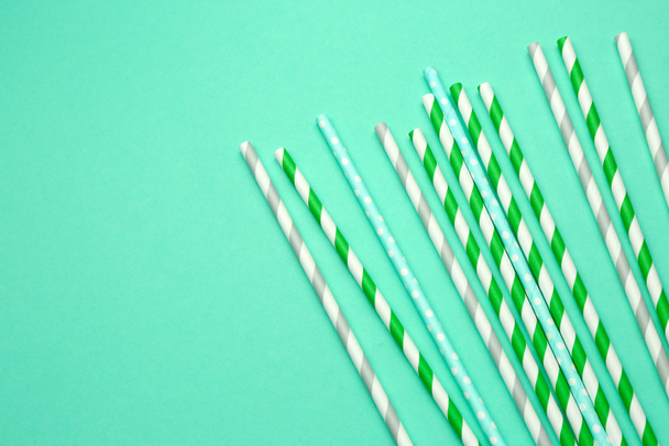 Stylish straws for drinks on turquoise background - Photo, Image