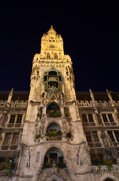 City hall with tall bell tower on Marienplatz in Munich at night without people - Photo, Image