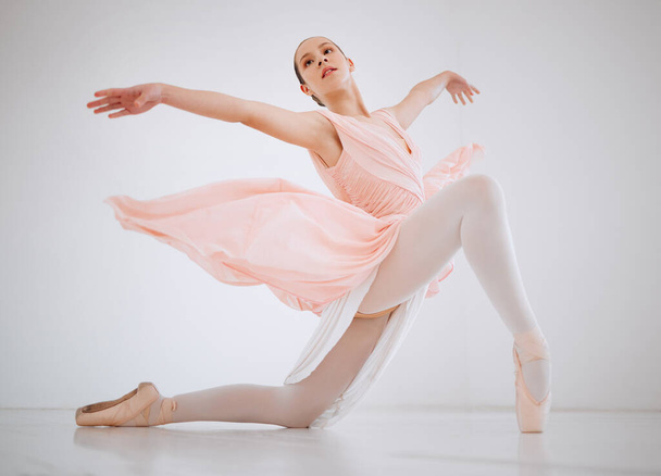 Dance with all your heart. Full length shot of an attractive young female ballerina practicing in her dance studio. - Foto, immagini