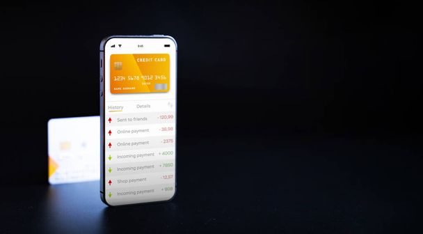 E-Banking-Konzept. Handy mit Internet-Online-Bank-App. Kreditkarte auf schwarzem Hintergrund. Online-Brieftasche spart Geld - Foto, Bild