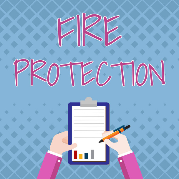 Inspiration showing sign Fire Protection. Business showcase measures taken to prevent fire from becoming destructive Business Associate Holding Clipboard Documenting Reports With Pen. - Photo, Image