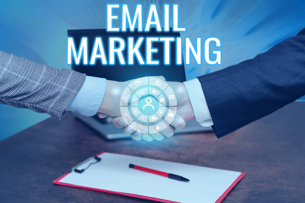Inspiration showing sign Email Marketing. Internet Concept Sending a commercial message to a group of showing using mail Hands Shaking Signing Contract Unlocking New Futuristic Technologies. - Photo, Image