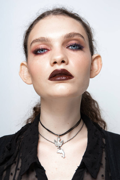 Portrait of a girl with a beautiful and unusual appearance with makeup - Photo, Image