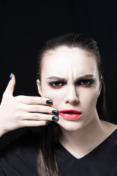 Creative Beauty Portrait with Red Lips and Blue Eyes on a Black Background  - Photo, Image