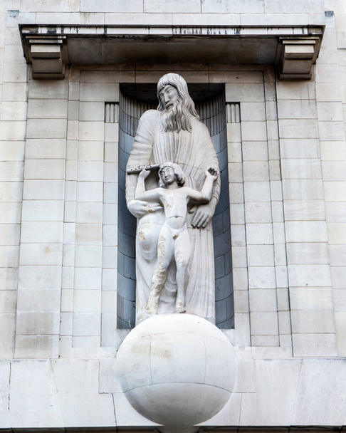 The sculpture on the exterior of the BBC headquarters, located on Portland Place and Langham Place in London, UK. The statue by Eric Gill has sparked debate due to the sculptors alleged sordid past. - Foto, Imagen