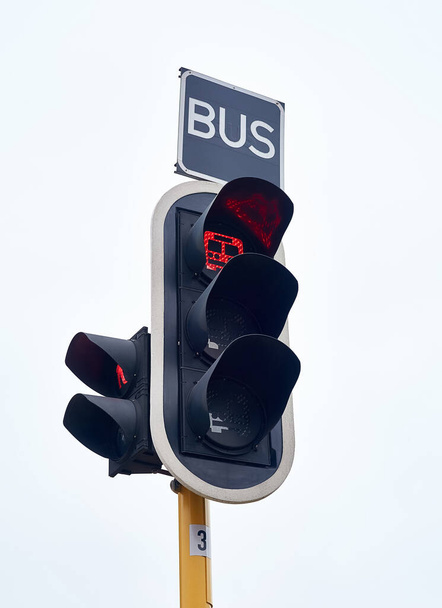 Buses only. Shot of traffic lights against a gray sky. - Photo, Image