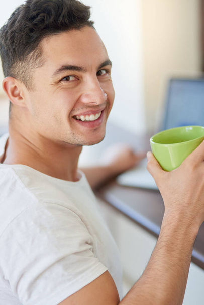 Heres to a good day. Cropped shot of a young man enjoying his morning coffee. - Photo, image