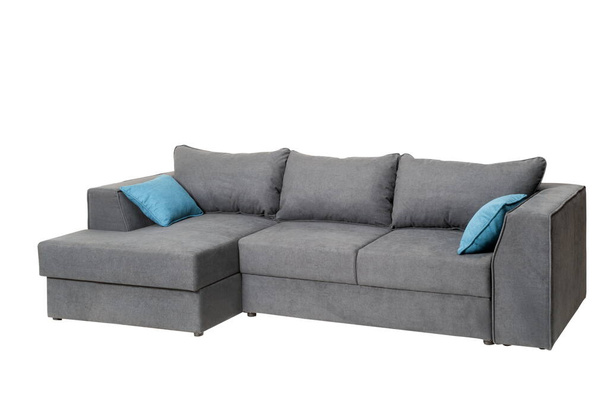 Large gray sofa with two blue pillows, on a white background, isolated - Fotografie, Obrázek