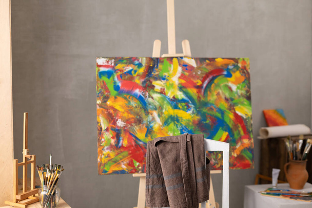 Chair and oil painting. Art still life and paintbrush painting in artist creative studio with painter tool - Photo, Image