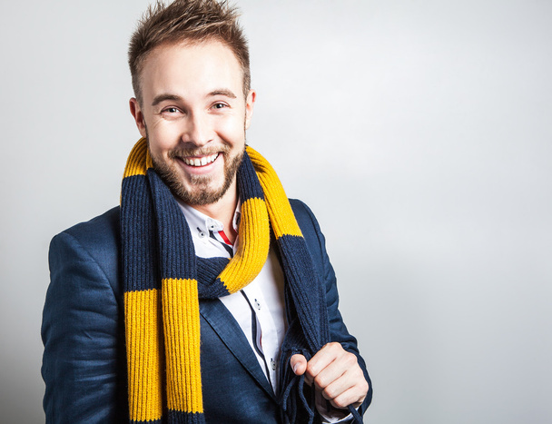 Elegant & Positive young handsome man in colorful scarf. Studio fashion portrait. - Фото, изображение