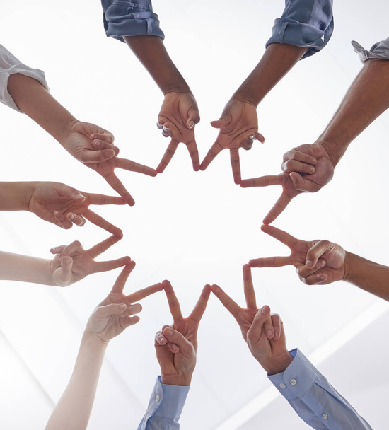 Dont forget that youre a star. Shot of a group of unrecognizable businesspeople making a star shape with their hands at work. - Photo, Image