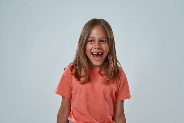 Front view of cheerful little girl with open mouth - Fotoğraf, Görsel