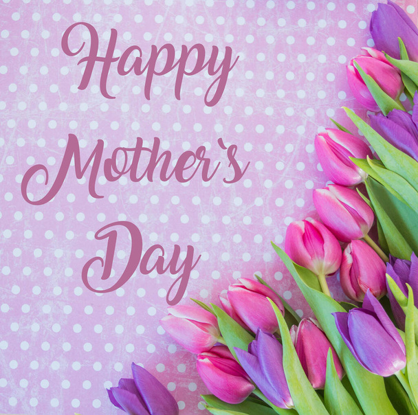 tulips on white dotted ground with happy mother`s day text background - Foto, imagen