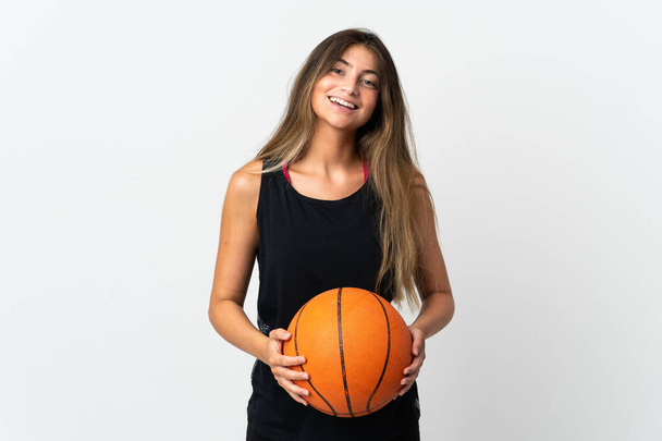 Young caucasian woman isolated on white background playing basketball - Fotó, kép