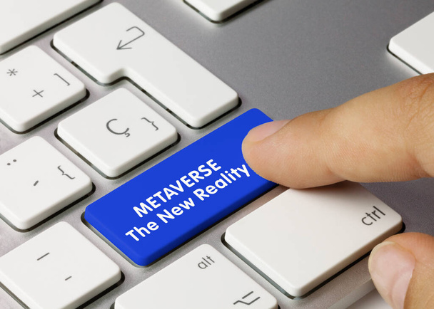 METAVERSE The New Reality Wing on Blue Key of Metac Keyboard. Нажатие пальца. - Фото, изображение