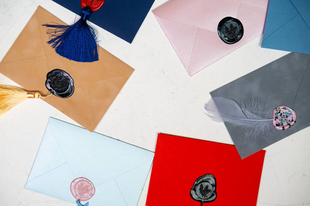 Lots of colorful envelopes. Envelopes sealed with wax. Correspondence concept. - Fotografie, Obrázek