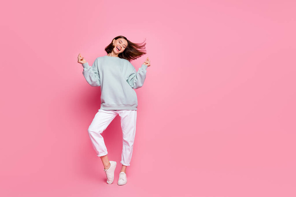 Full size photo of young cheerful girl good mood dancing clubber hang-out isolated over pink color background - Foto, immagini