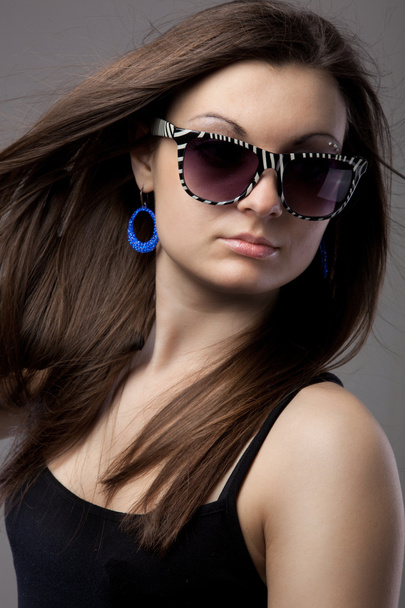 Portrait of attractive young woman in glasses - Φωτογραφία, εικόνα
