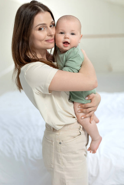 A woman with a small child. Mom with a baby. - Zdjęcie, obraz
