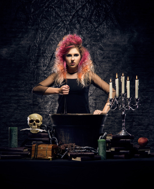 Beautiful witch making witchcraft - Fotó, kép