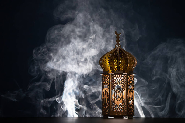 Ramadan Kareem background. Ornamental Arabic lantern glowing at night - Φωτογραφία, εικόνα