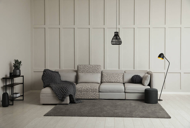 Living room interior with comfortable sofa near molding wall - Foto, immagini