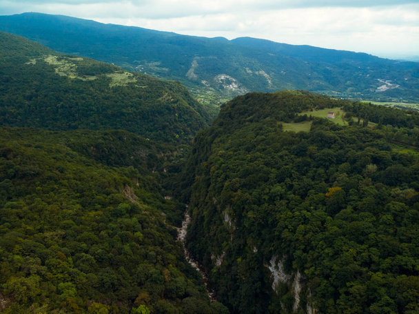 Okace canyon aerial view. The mountains are covered with green forest. Natural landscape. Vacation and Travel. Tourist place in Georgia. - Фото, зображення