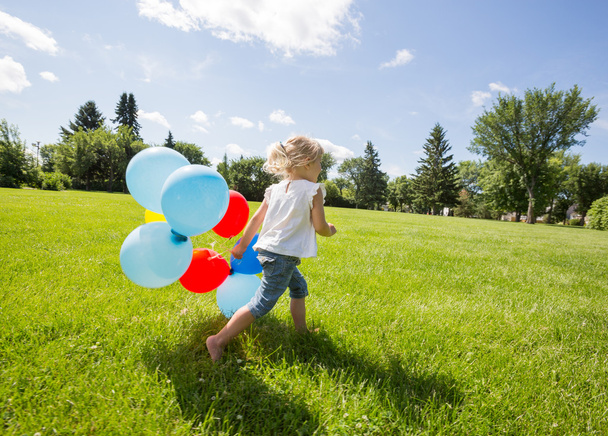 Girl With Balloons Running In Meadow - Фото, изображение
