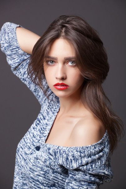 Fashion portrait of beautiful woman with red lips in knitted sweater - Foto, immagini
