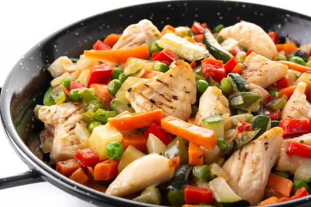 Chicken stir fry and vegetables isolated on white background. Close up - Photo, Image
