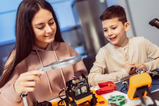 Children making a robot at home. Education in robotic at home. - Photo, Image