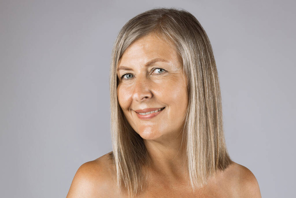 Portrait of mature woman with natural wrinkles on skin - Fotografie, Obrázek