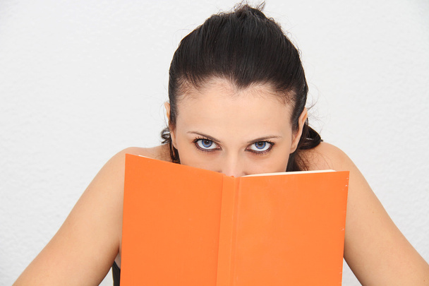 Attractive young woman reading book - Foto, Bild