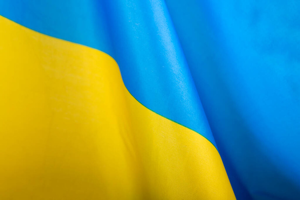 Flag of Ukraine. Blue and yellow colors. Close up shot, background - Fotoğraf, Görsel