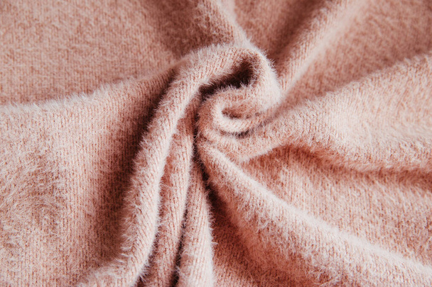 Pink fluffy fabric for drapery. A piece of warm cloth with folds. Wrinkled and shaggy Texture - Foto, immagini
