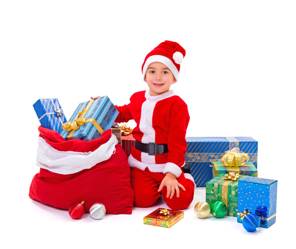 Little Santa Claus boy with presents - Foto, afbeelding