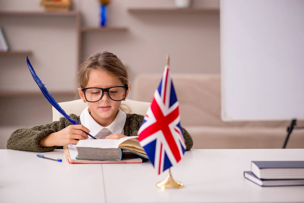 Young little girl studying english language at home - Photo, Image