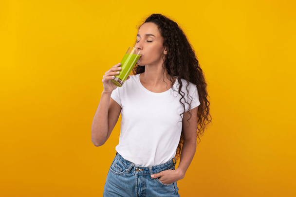Portrait of Confident Young Lady Drinking Smoothie - Photo, Image