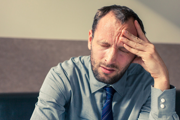 Stressed businessman getting headache - Foto, Imagen