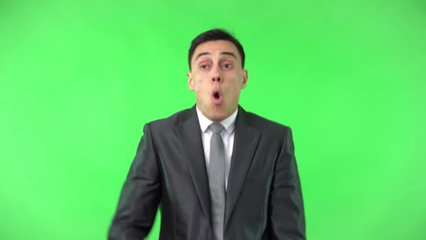 Shocked man in elegant suit looking at camera - Footage, Video