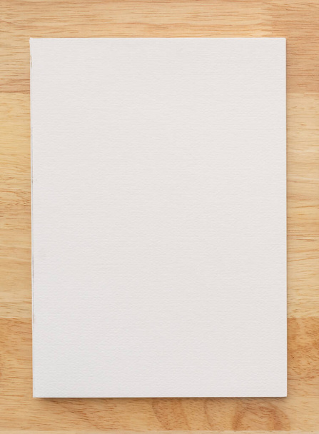White cover of sketching book on wood for art background. Close up. - Φωτογραφία, εικόνα