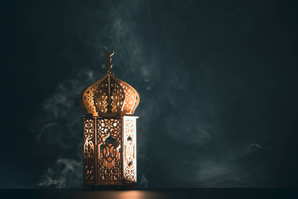 Ramadan Kareem background. Ornamental Arabic lantern glowing at night - Zdjęcie, obraz
