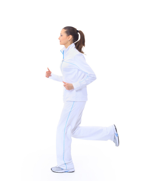 Attractive girl running isolated on white background - Foto, Bild