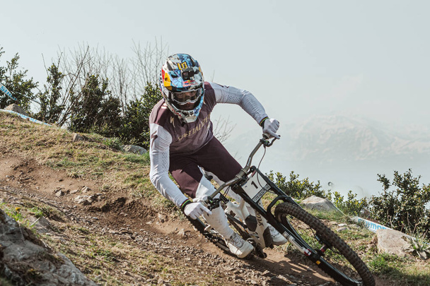 Lourdes, France : 2022 March 27 : BRUNI Loic FRA competes during the UCI Mountain Bike Downhill World Cup 2022 race at the Lourdes, France. - Photo, Image