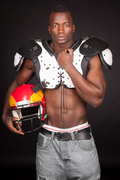 Football Player with American Football Shoulder and helmet - Photo, image