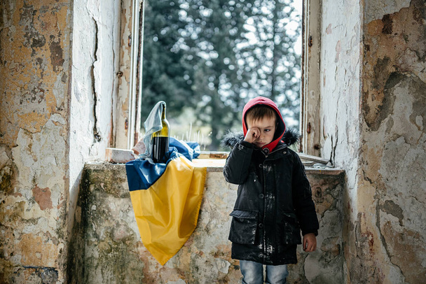 Little Boy in a Ruined House War in Ukraine Ukrainian flag - Valokuva, kuva